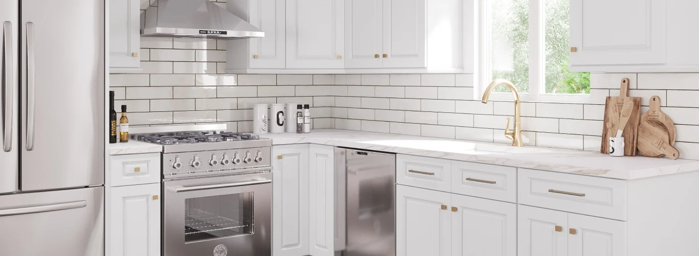 A white kitchen with Aspen Dakota White cabinetry and gold hardware.
