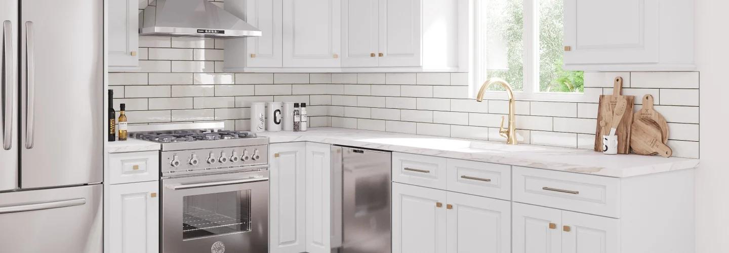 Modern kitchen with white cabinets and stainless steel appliances; Clean, minimalist kitchen design with white countertops.